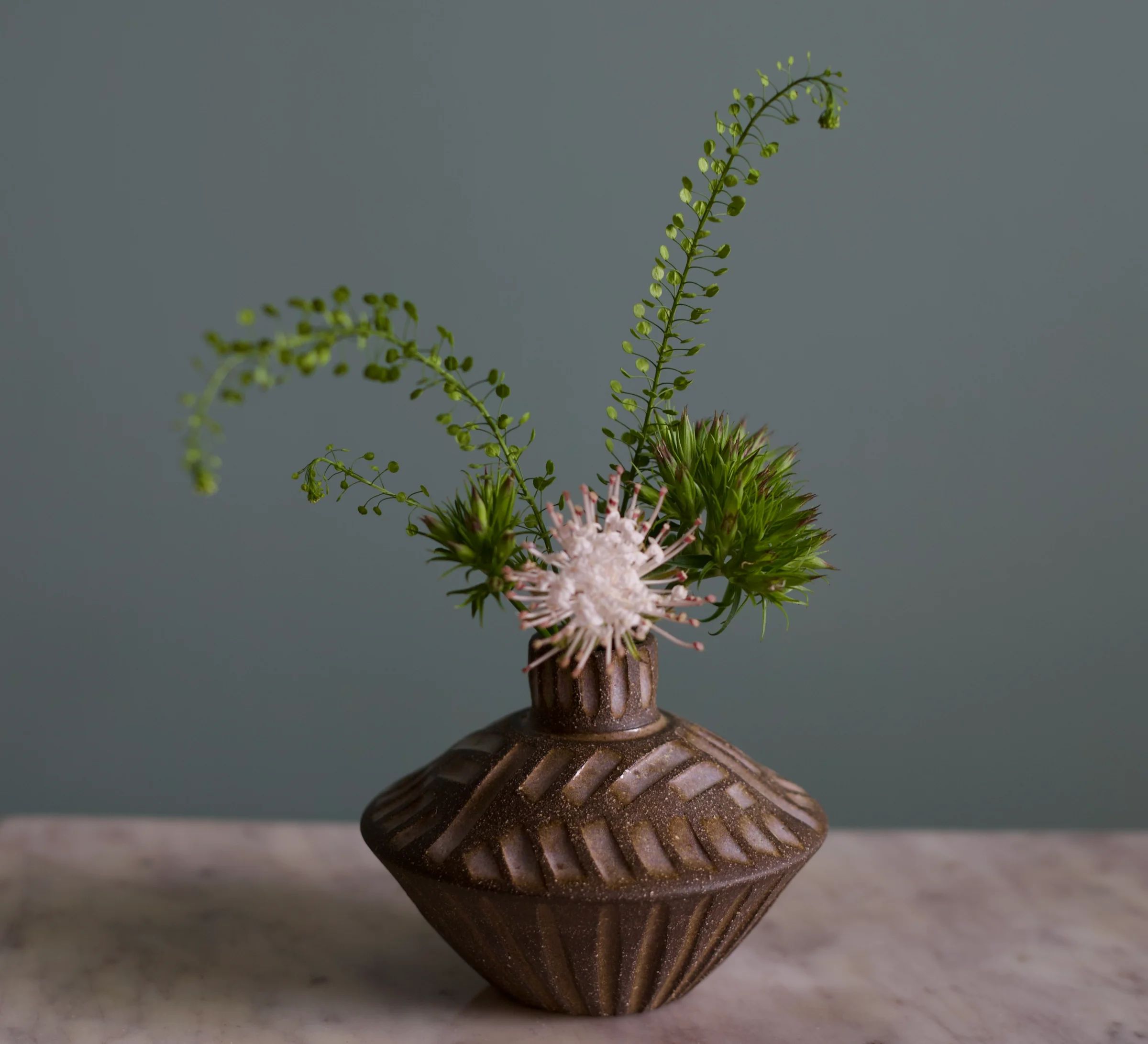 Saucer bud vase by Stoneware by Susannah Wilson