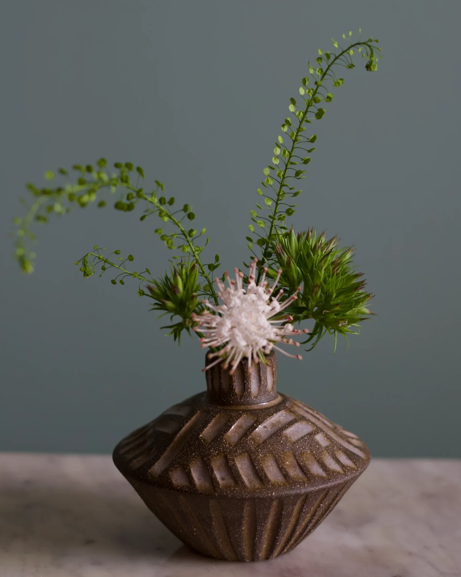Saucer bud vase by Stoneware by Susannah Wilson