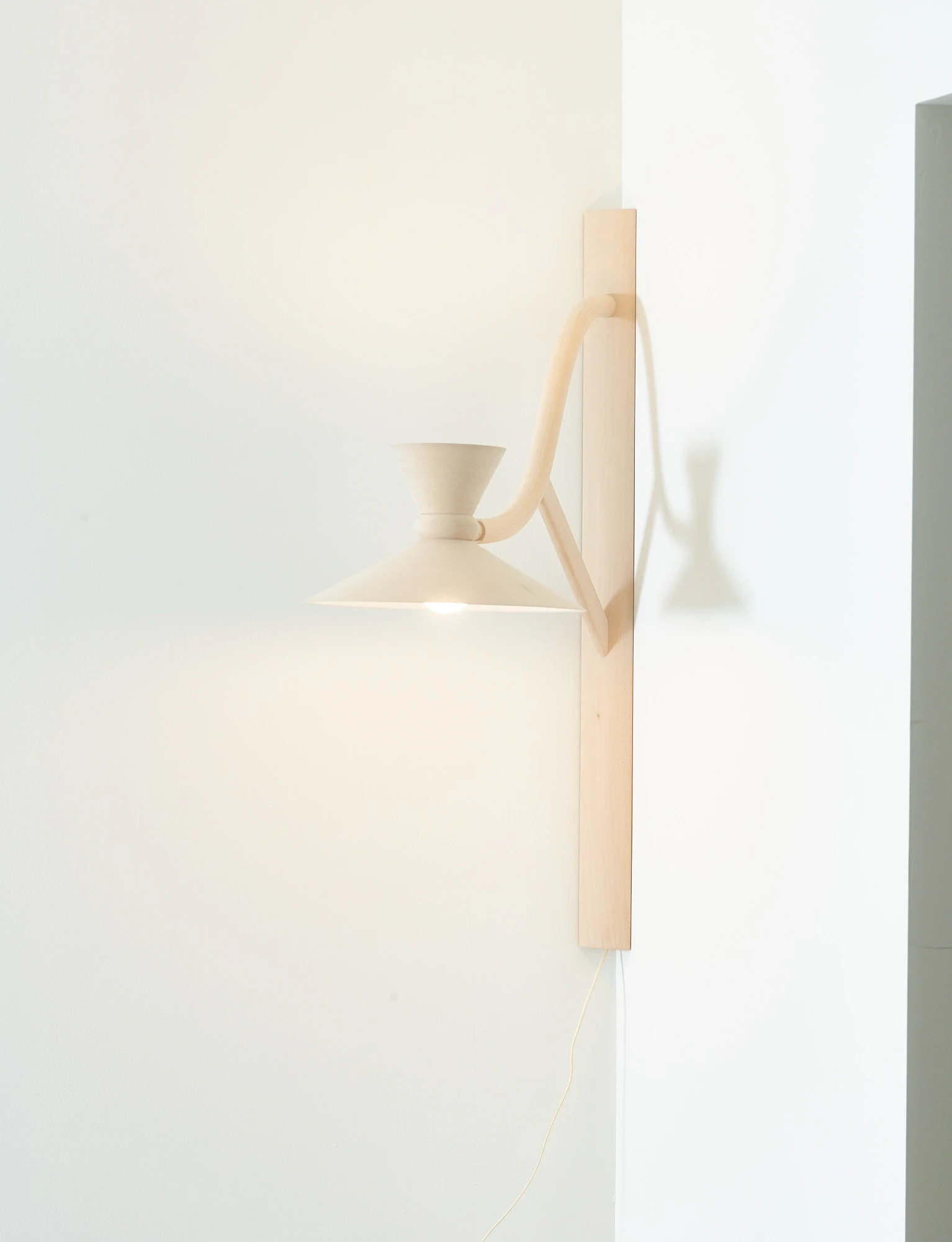 Corner bracket lamp by Aaron Getman-Pickering
