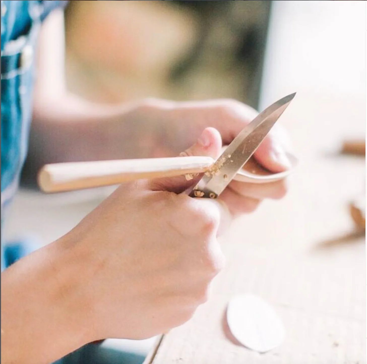 Carving the "neck" of a spoon. 